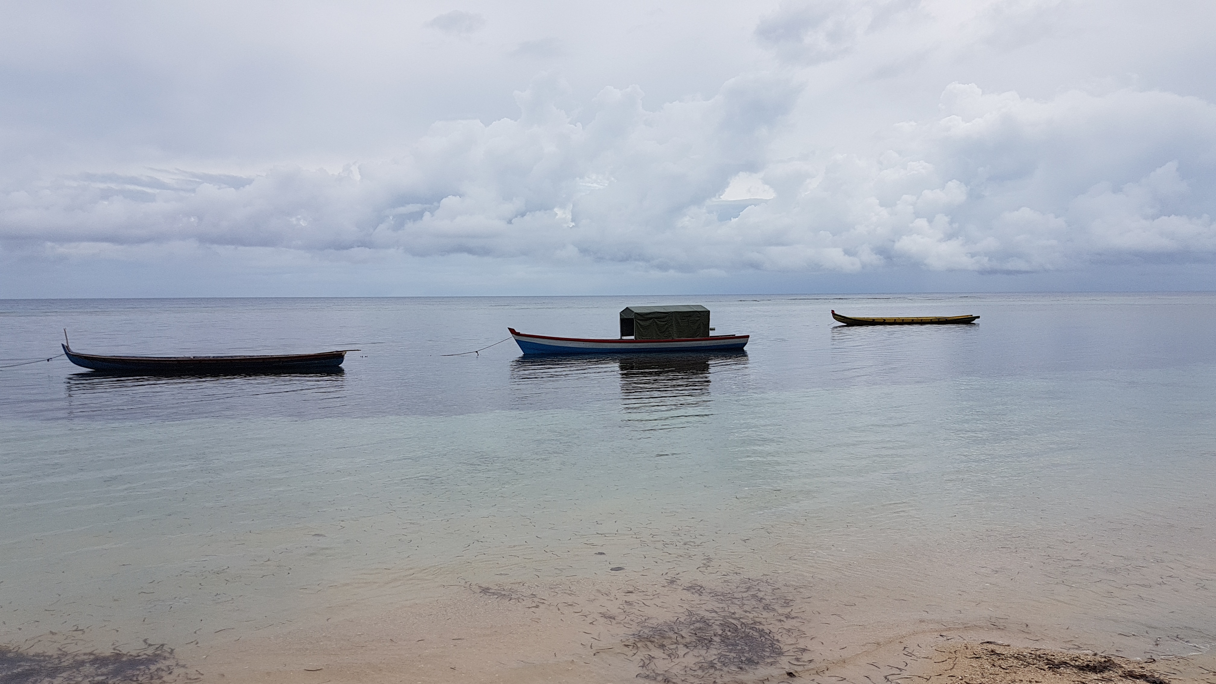 Beach and local fishing boats in Enggano