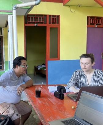 Pak Adam (left) and Charlotte checking the transcription of a recording